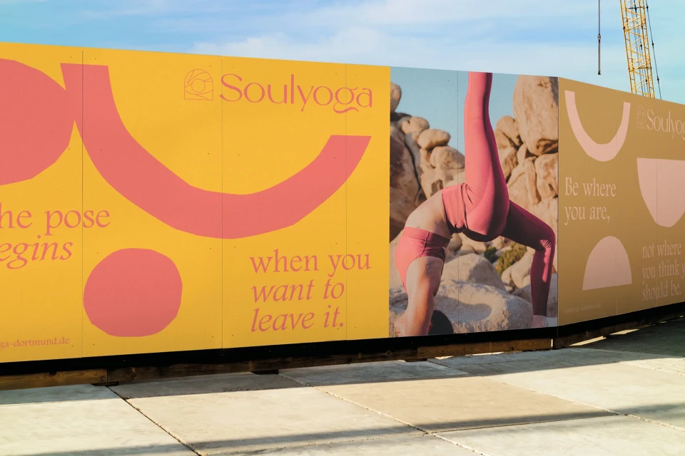 Yoga advertisement featuring a woman in a bridge pose against a desert landscape, with text overlay and brand logo for Soulyoga.