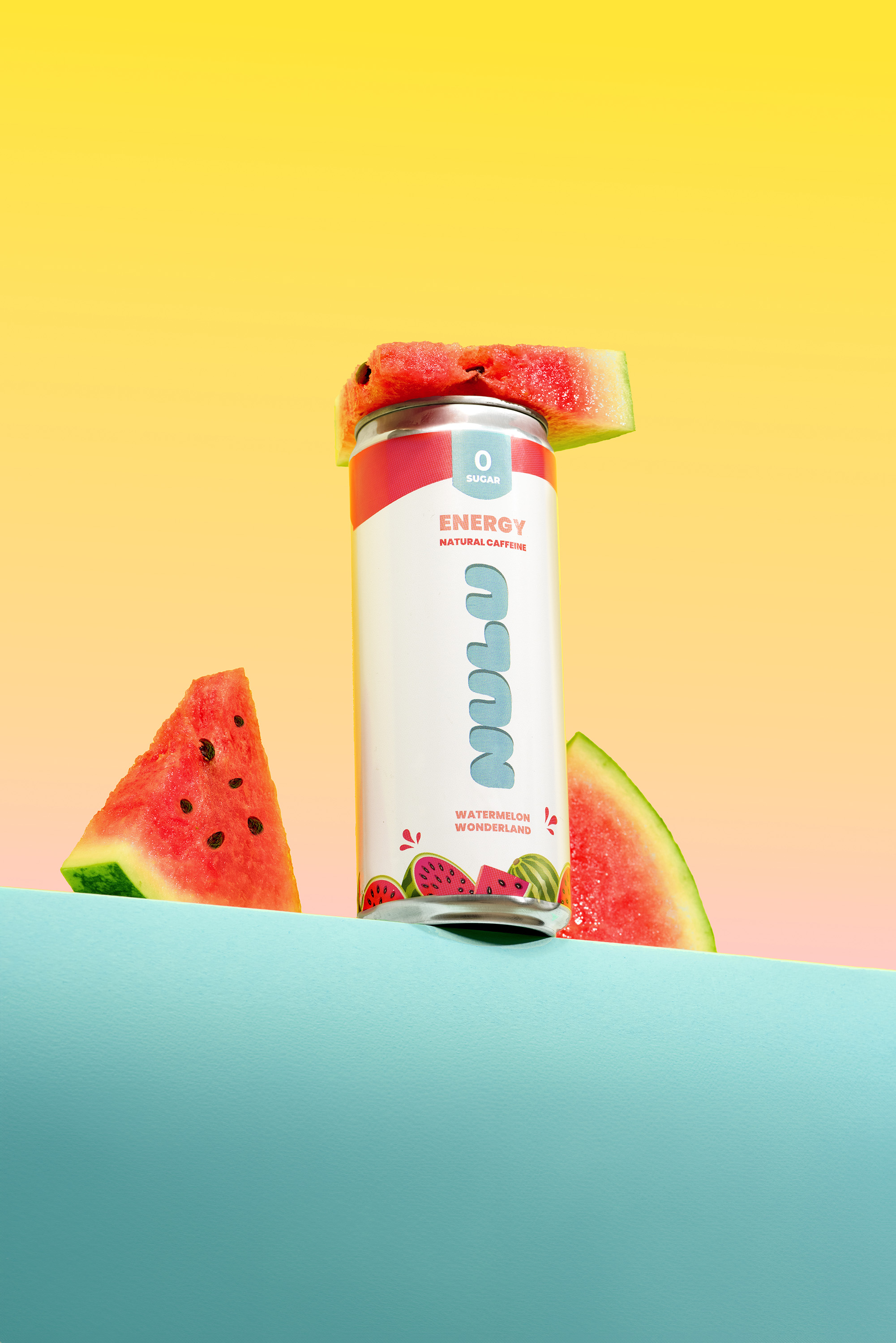 A can of Nulu energy drink is staged with watermelon slices against a split yellow, orange, and teal backdrop in a studio shot.
