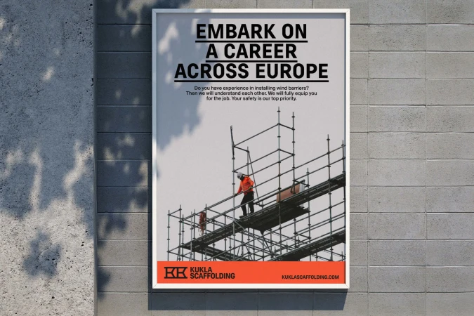 Recruitment poster for Kukla Scaffolding showing construction workers on scaffolding against a grey sky, affixed to a textured concrete wall.