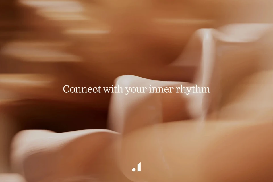 Abstract fluid forms in blended shades of tan and brown, with blurred motion effect, and brandmark at bottom.