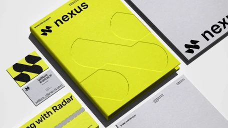 Nexus Logistics brand identity stationary layout featuring a bright yellow folder, business card, and letterhead on a white surface.