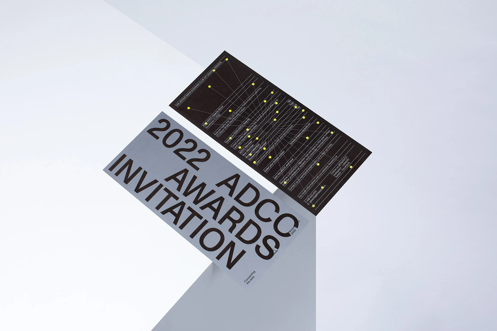 ADCC Awards Invitation, 2022, laying flat on a white surface. Design features typography and line-based graphics in black and white.