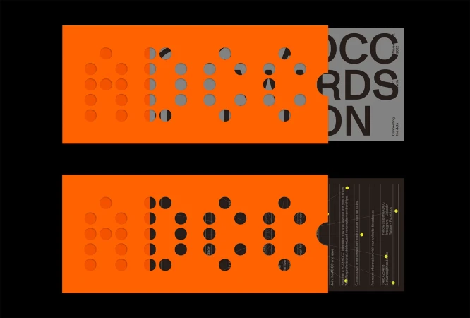 Orange perforated slipcases revealing grey and black graphic typography for the Advertising & Design Club of Canada brand identity.