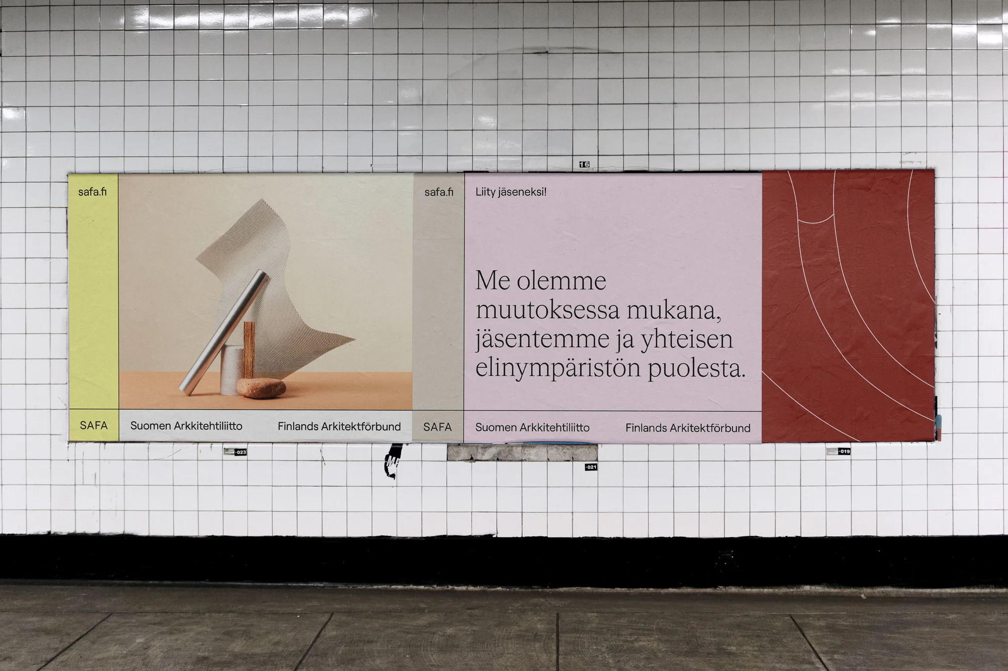 Indoor subway station displays an advertisement featuring an architectural still life, text in Finnish, promoting SAFA architectural association.