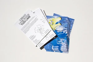 Stacked promotional flyers and cards for Urban Lemonade with typography and blue water imagery.