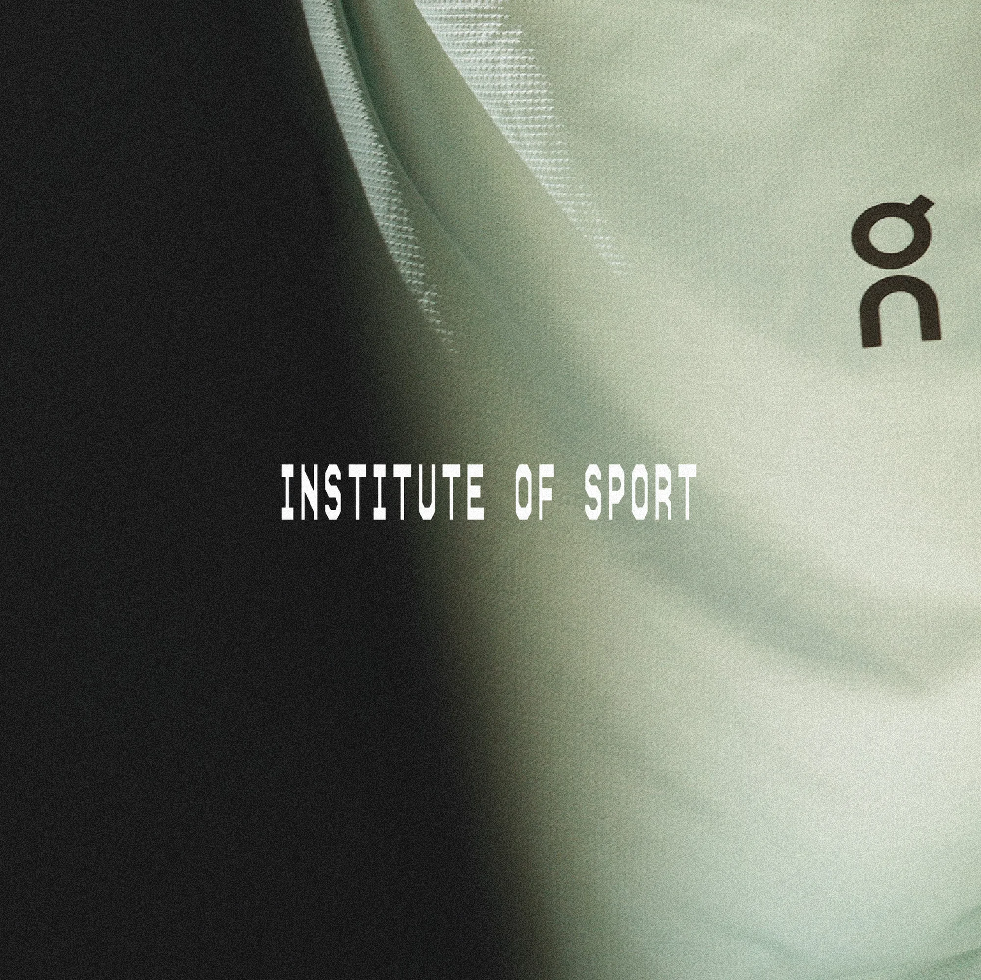 A studio shot of a draped, light-green textured fabric with black text spelling 'Institute of Sport' and an athletic brand logo.