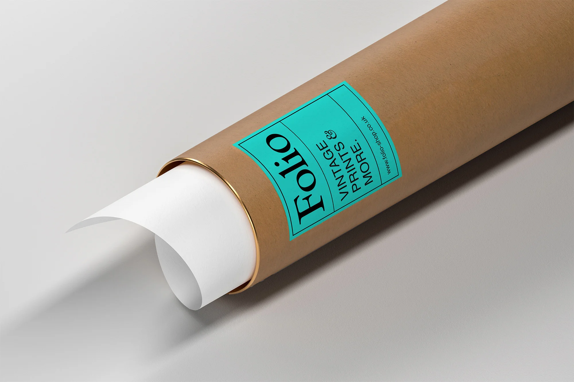 Brown cardboard tube with blue Folio Vintage Prints label and white paper scroll end against a light gray surface.
