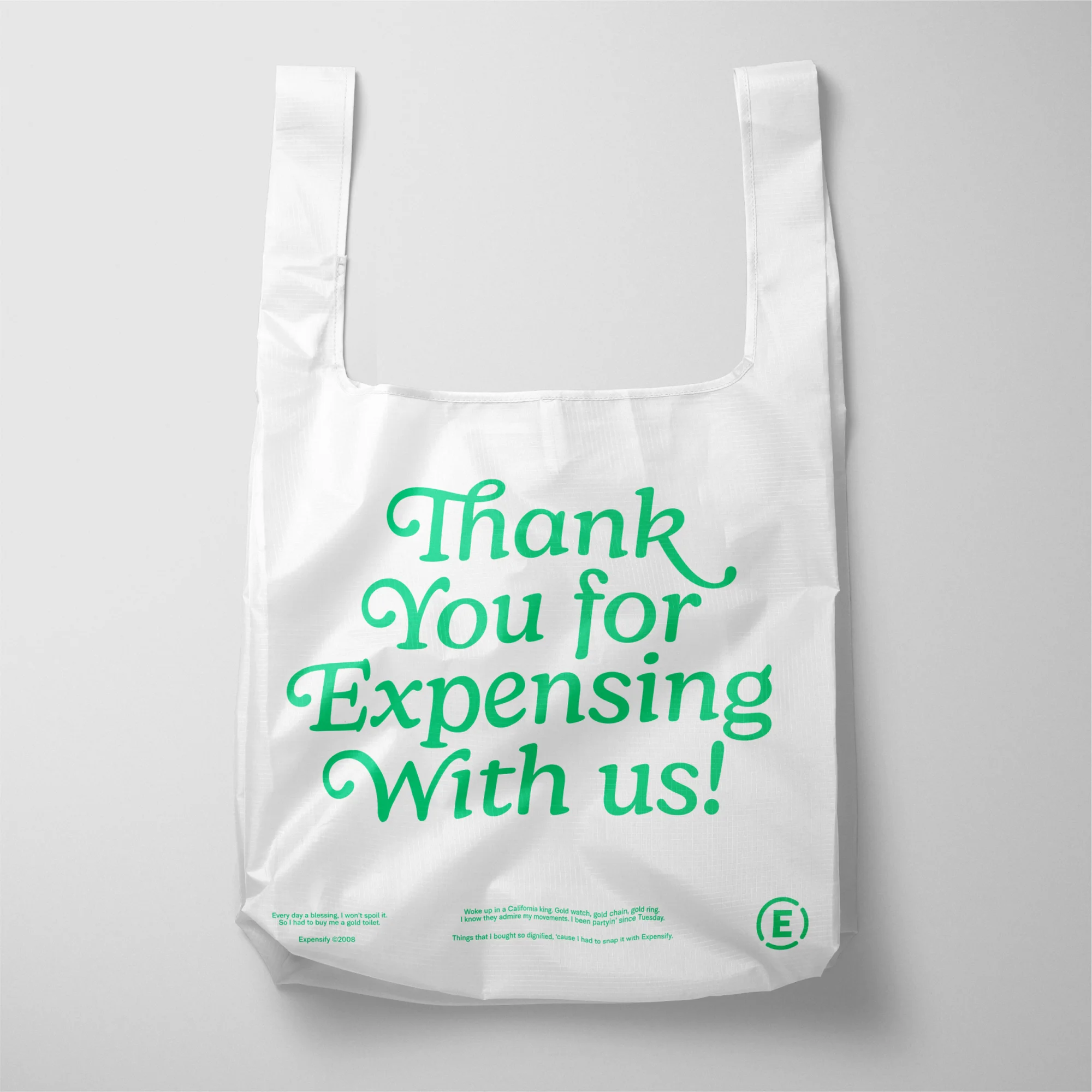 White reusable shopping bag with green text "Thank You for Expensing With Us!" against a white background, eco-friendly shopping.