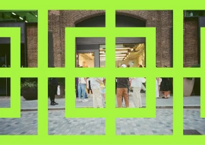 Bright green graphic frame overlaying an outdoor street scene with people walking past brick buildings.