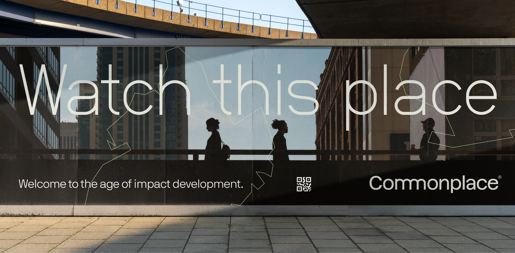 Outdoor advertising banner with silhouettes of pedestrians and modern architecture, promoting Commonplace and impact development.
