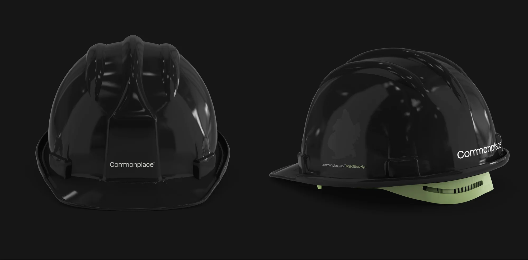 Two black construction hard hats with the brand name Commonplace are shown on a dark gray background in a studio shot.