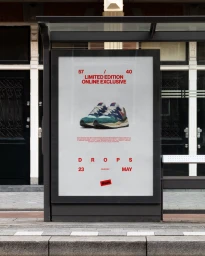 Bus shelter advertising poster displaying a pair of sneakers on white background with red typographic text.