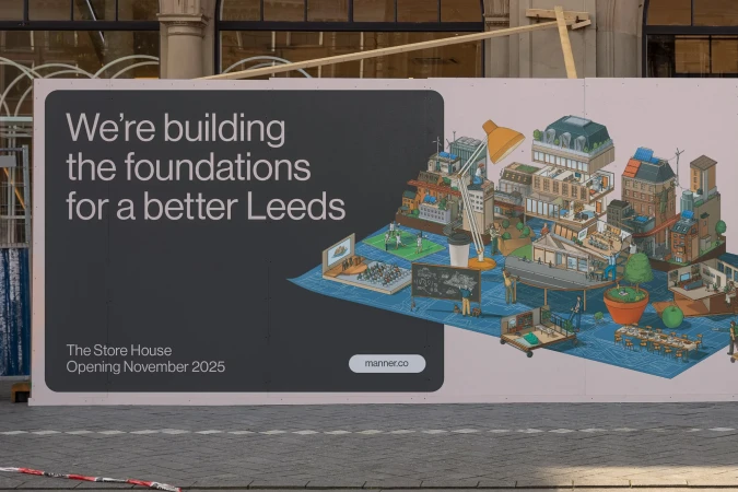 Construction hoarding featuring an illustration of Leeds buildings and text about the Store House opening in November 2025.
