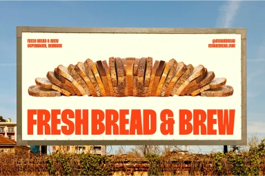 An outdoor advertising billboard displaying sliced bread arranged symmetrically against a clear sky