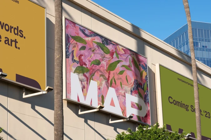 Billboard art featuring an abstract floral painting with pink, green, and blue hues, and a bold white "MAP" logo against a building facade.