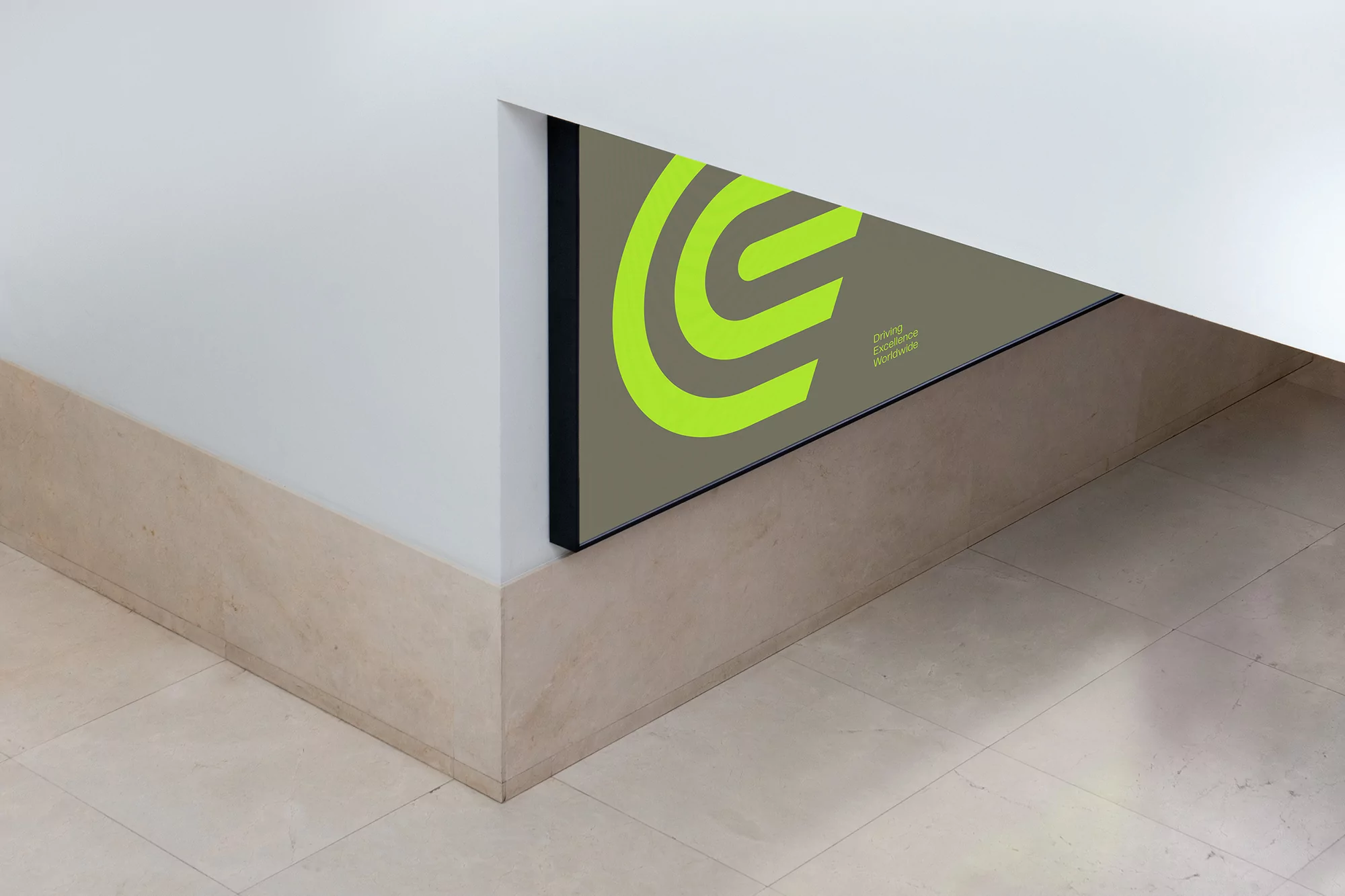 Abstract architectural shot featuring a green logo on gray panel within a white and beige interior wall with tiled flooring.