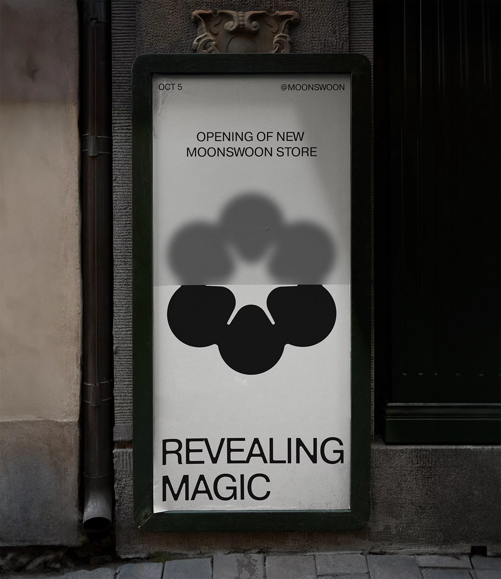 Advertisement for the opening of new Moon Swoon store with black and grey graphic design on a white poster. Located on a city street.