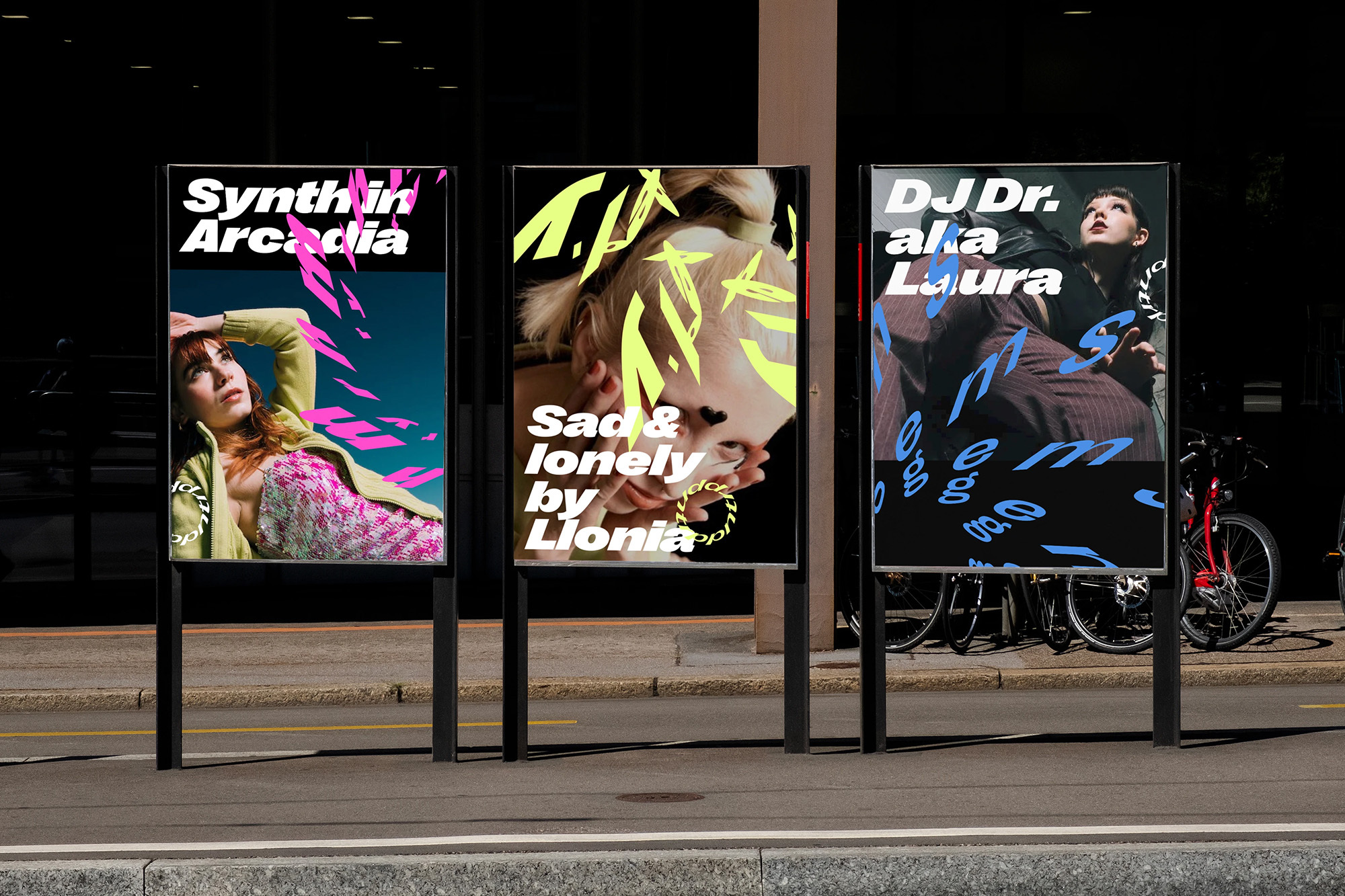 Outdoor shot of three poster stands displaying unique visuals with bold typography, showcasing creative art and music events in urban setting.