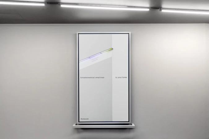 Framed advertisement for Homevolt featuring a minimalistic aesthetic with the text 'Extraterrestrial smartness to your home'.