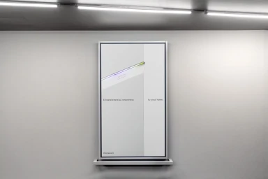 Vertical digital display screen mounted on a grey wall featuring minimalist product branding and graphic design for Homevolt.
