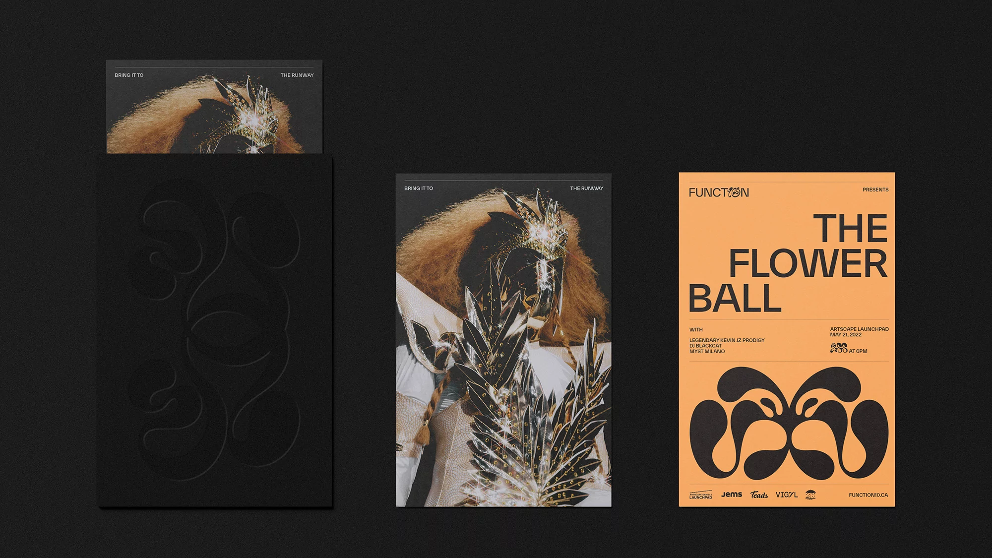 Graphic design posters on a dark gray surface featuring a masquerade mask, floral elements, and event typography.