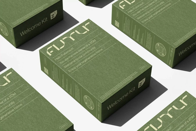 Angled shot of olive green boxes with Futurnaut branding, stacked on a white surface. Minimalist product presentation with consistent branding.