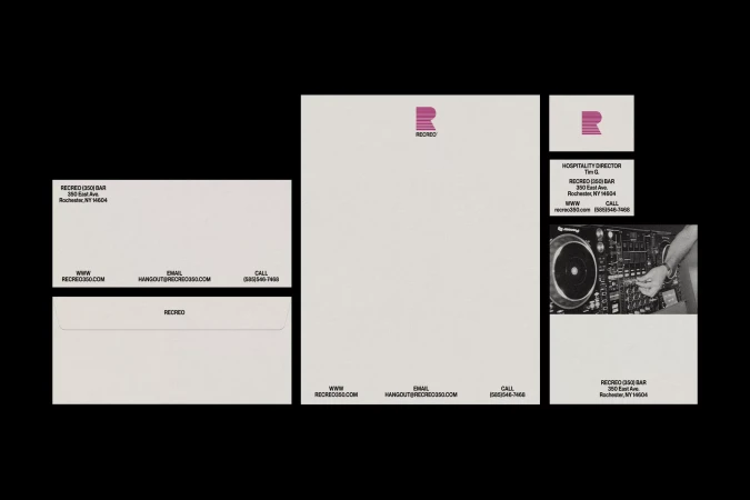 Branding materials featuring stationery, business card, and DJ equipment, all displaying a logo, presented on a black backdrop.