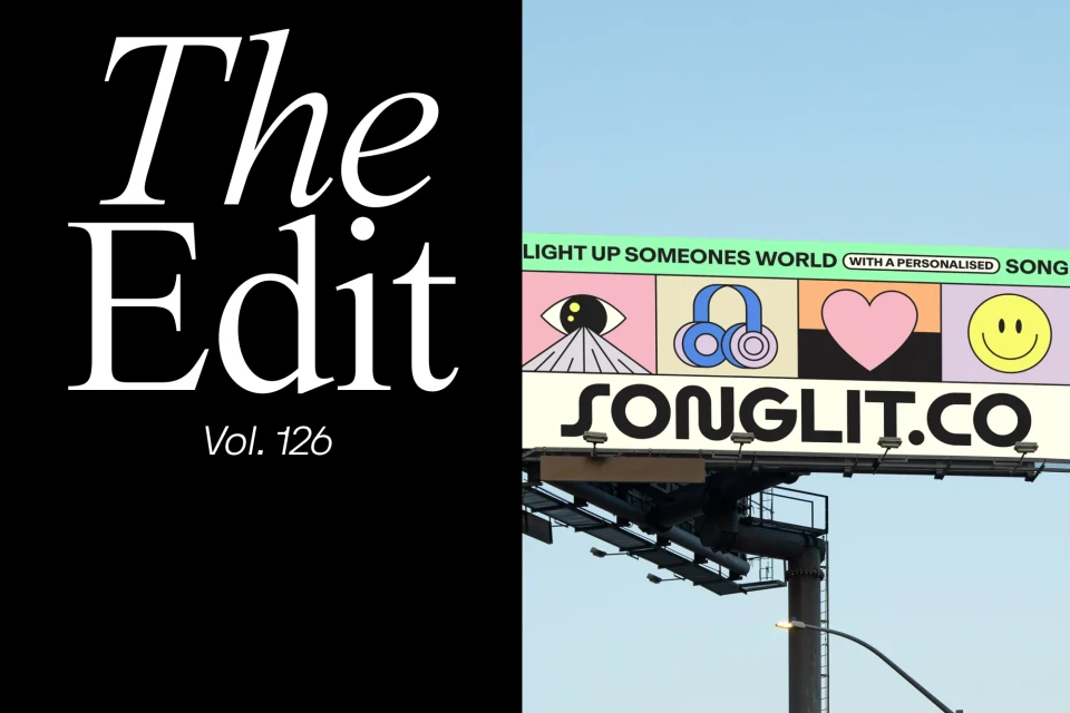 Billboard ad for Songlit featuring graphic icons of an eye, headphones, a heart, and a smiley face against a clear blue sky.