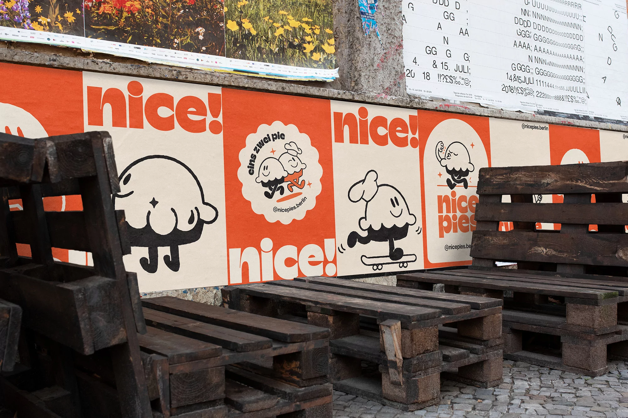 Urban scene displays wood pallet furniture next to a colorful mural featuring cartoon ice cream characters and the text "nice!" in bright colors.