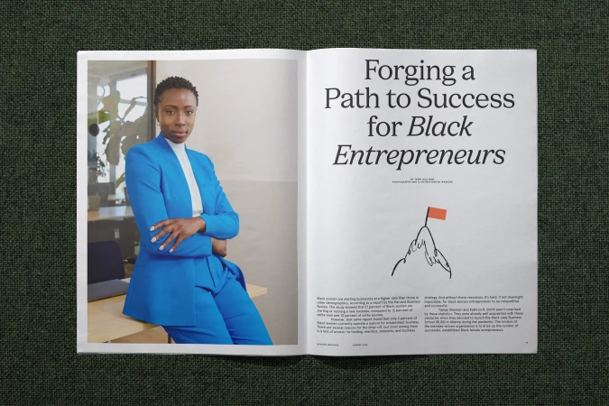 Magazine spread shows a portrait of a confident Black woman in a bright blue suit next to an article on Black entrepreneurs.