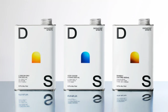 Three white cans of Departed Spirits brand gin, vodka, and whiskey are displayed on a reflective surface against a white background.