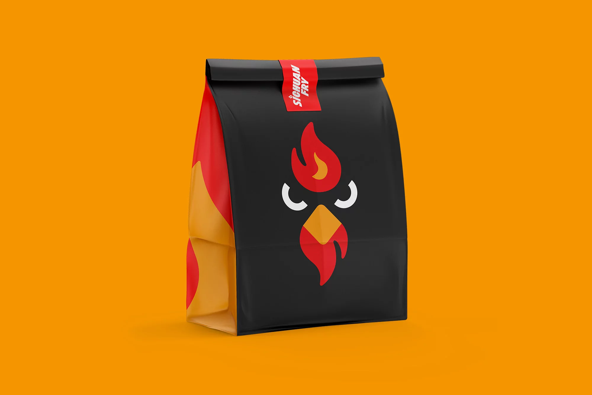 A black paper bag with a stylized fiery chicken logo sits against a bright orange background, simple studio product shot.