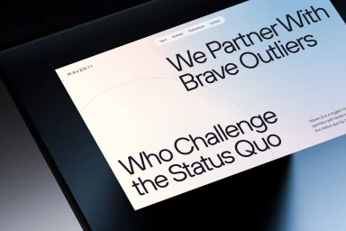 Close-up view of a digital screen displaying the Maven 11 brand identity website with large typography and clean layout.