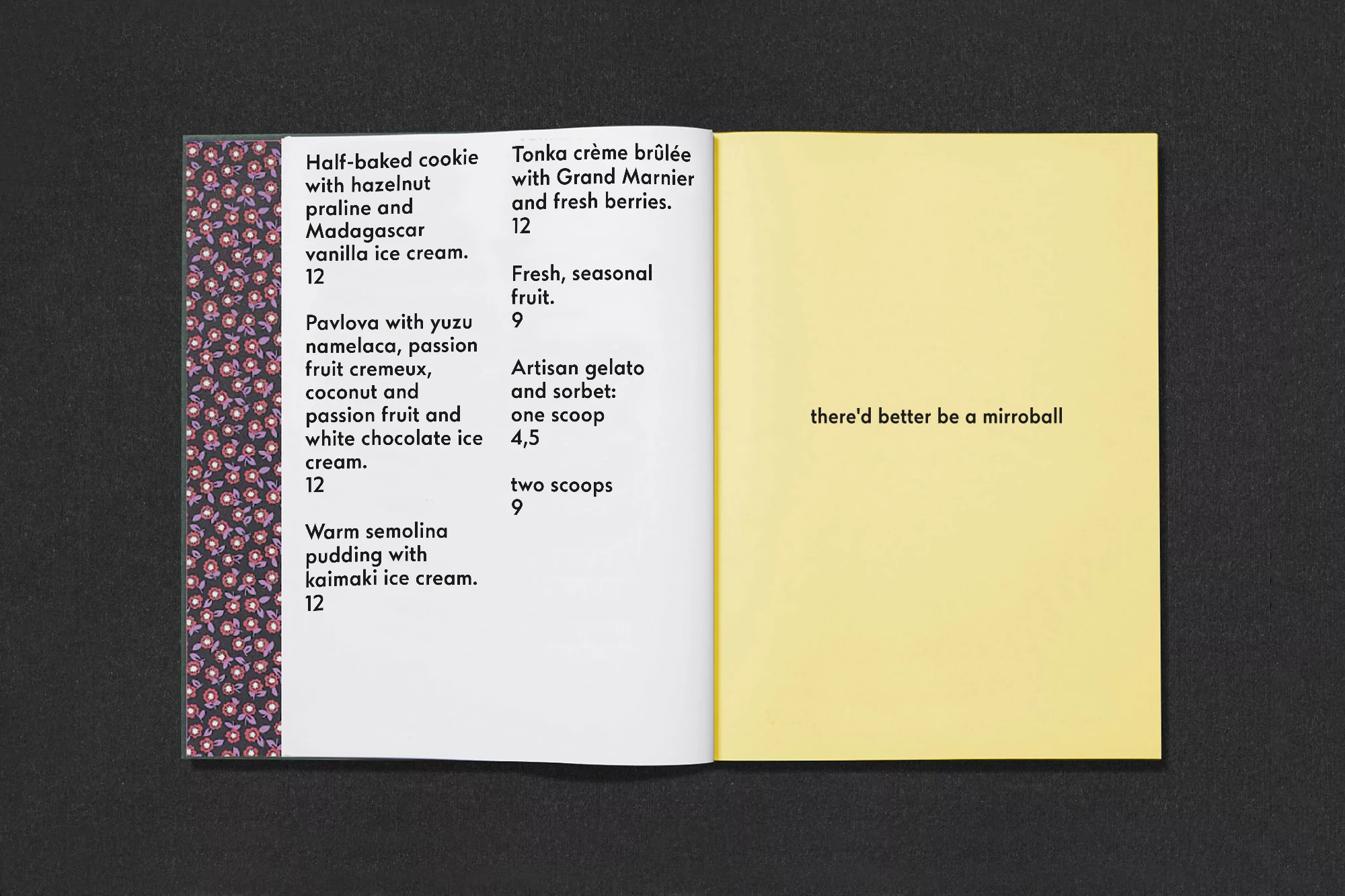 Open book with menu on the left page listing desserts and a yellow page on the right with the text, 'there'd better be a mirrorball'.