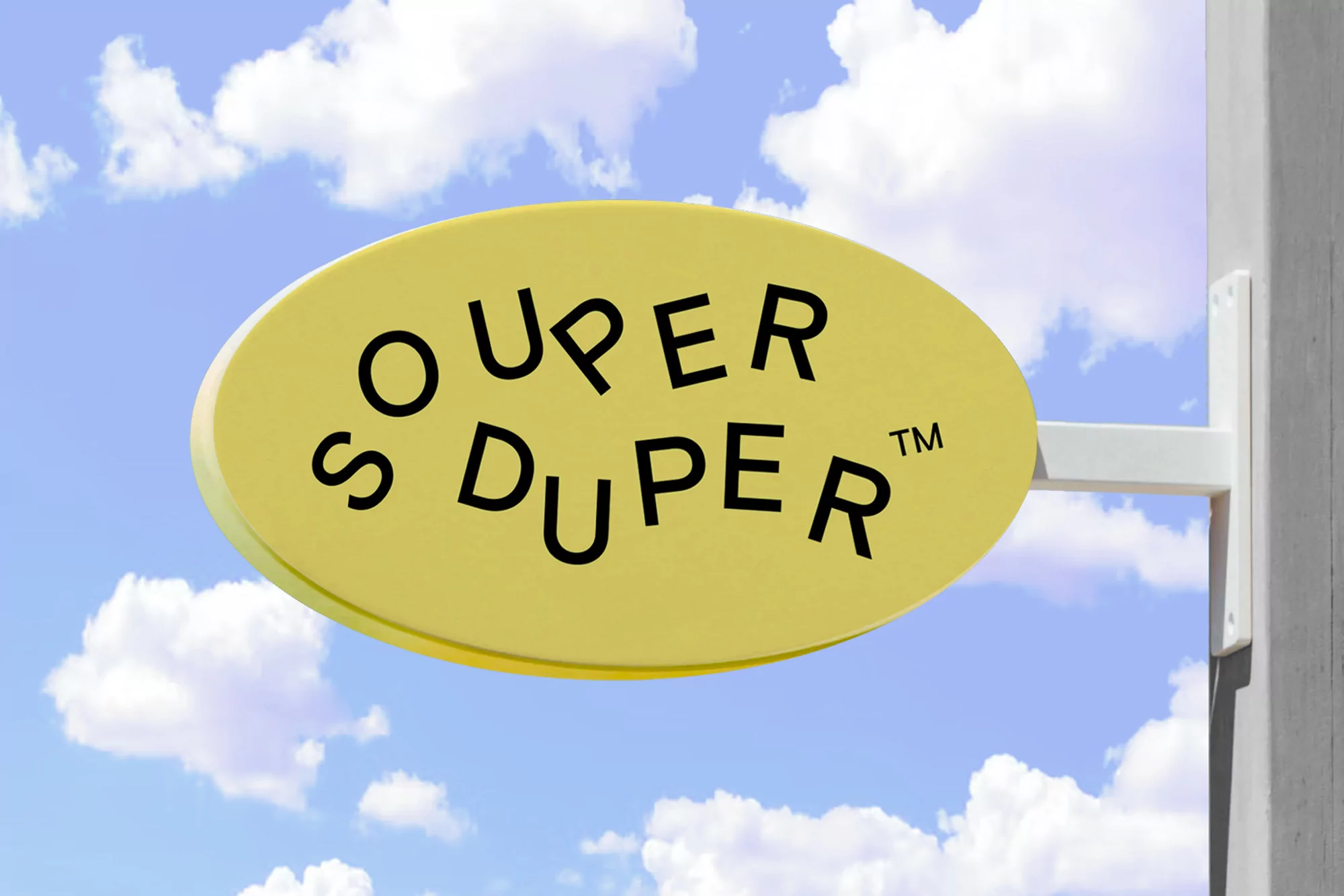 A yellow, oval-shaped sign reading 'Super Duper' in black letters is mounted on a white post against a backdrop of a blue, cloudy sky.