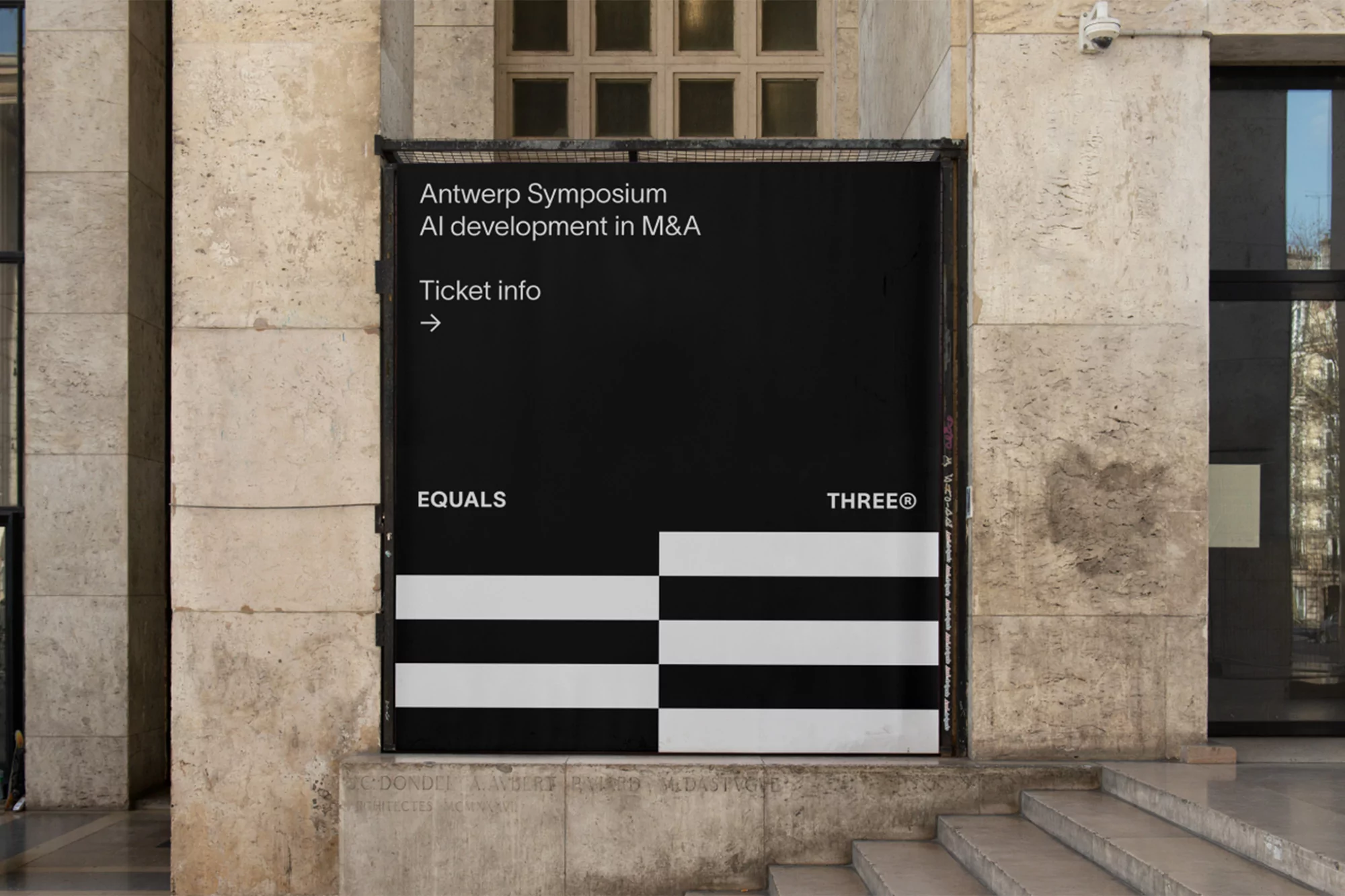 Promotional sign for the Antwerp Symposium on AI in M&A featuring Equals and Three® logos, set against a travertine stone building facade.