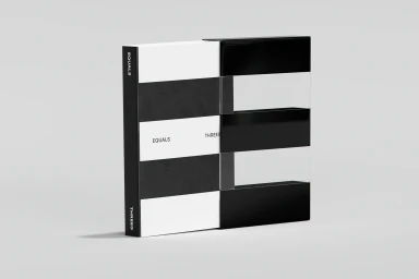 Black and white book box packaging with typographic equals sign design on a clean light grey studio background.