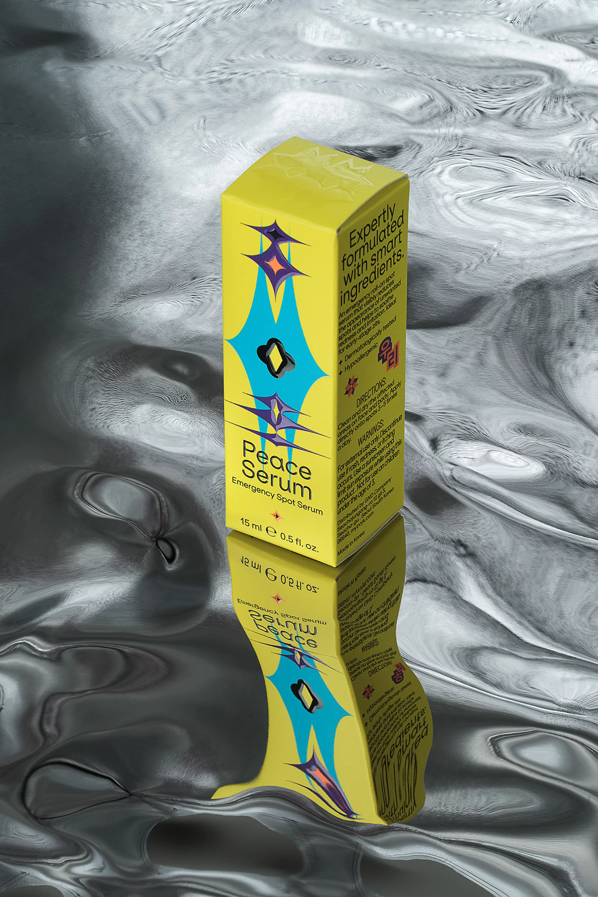 Cosmetic serum box in yellow and blue with geometric shapes reflected on a fluid metallic background, studio shot, product photography.