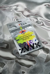 ZVYK brand confidence patch product packaging resting on a reflective crinkled silver foil surface.