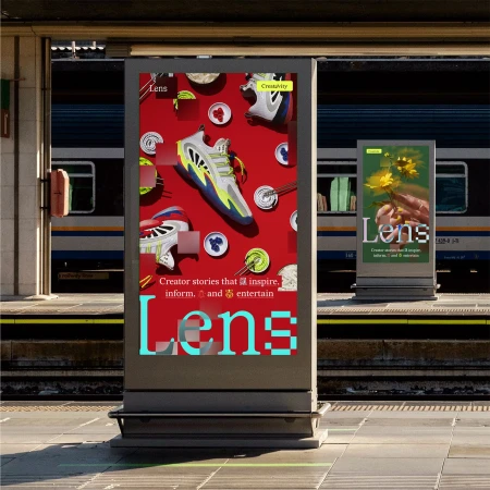 Eye-level shot of two digital billboards in a train station, one showcasing sneakers and the other displaying flowers.