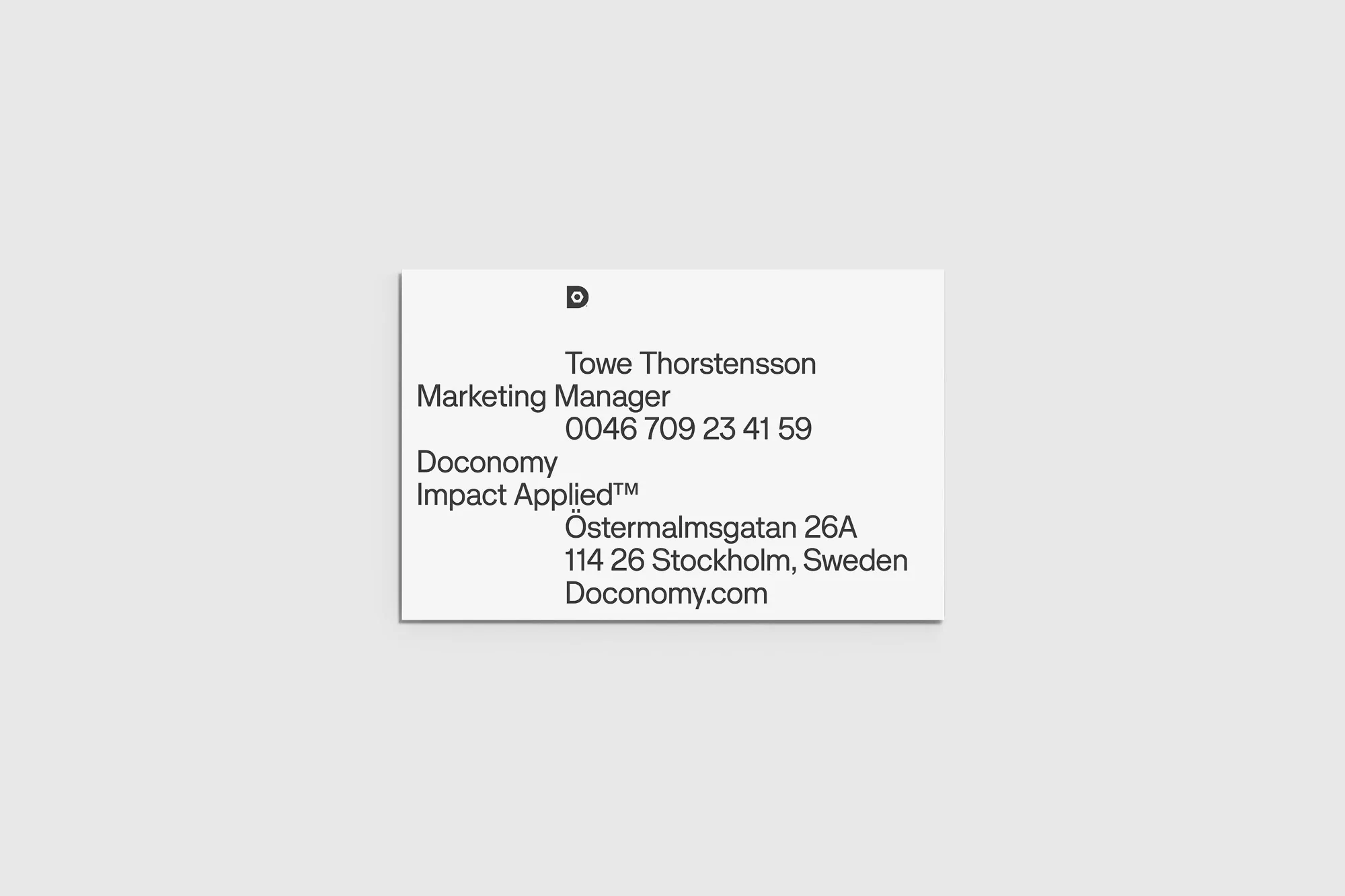 Close-up business card for Towe Thorstensson, Marketing Manager at Doconomy, featuring contact information and the company logo.