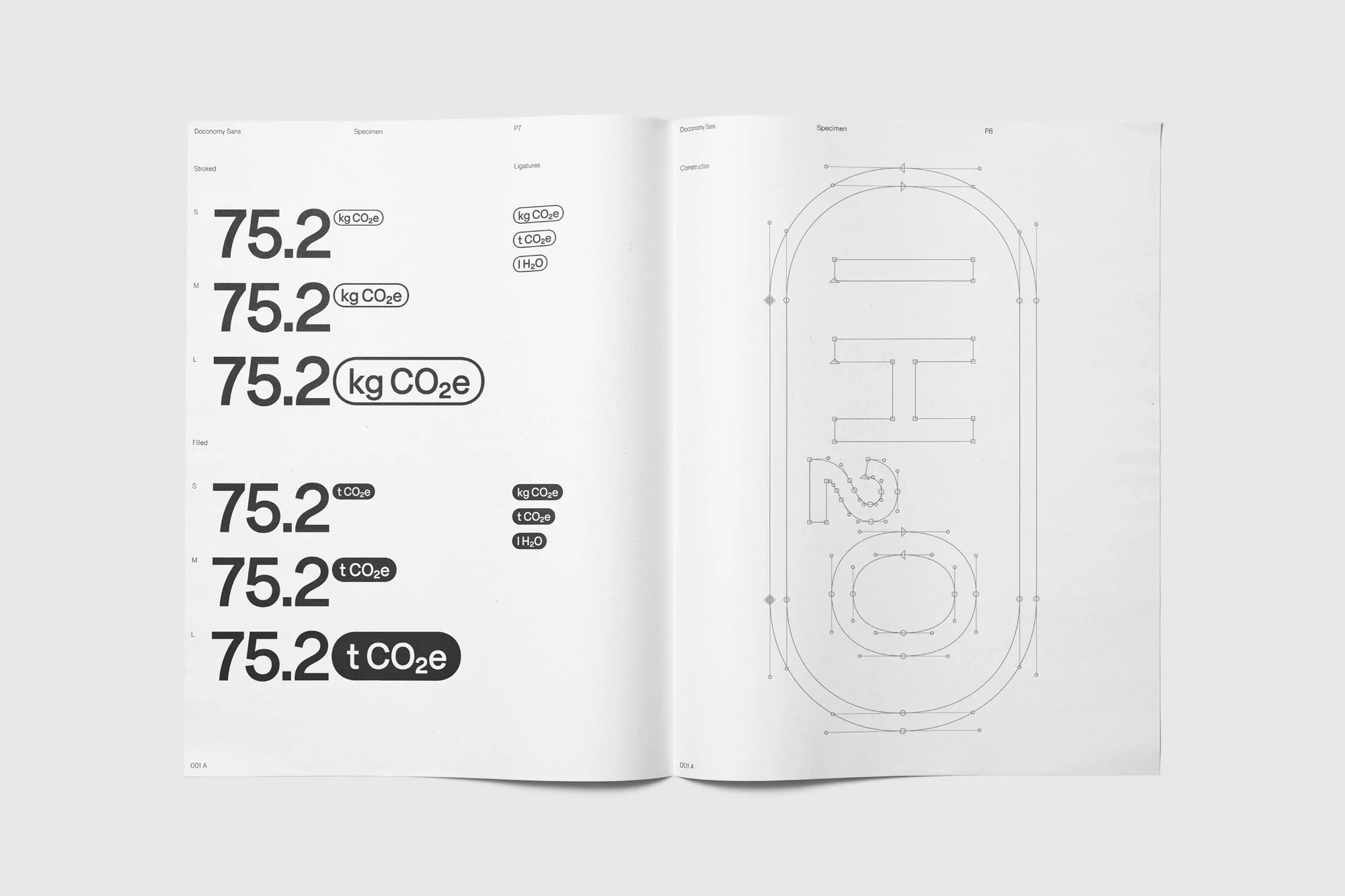 Open book showing graphic design with numerical data and line-drawing letters, creating an informational and visually engaging layout.