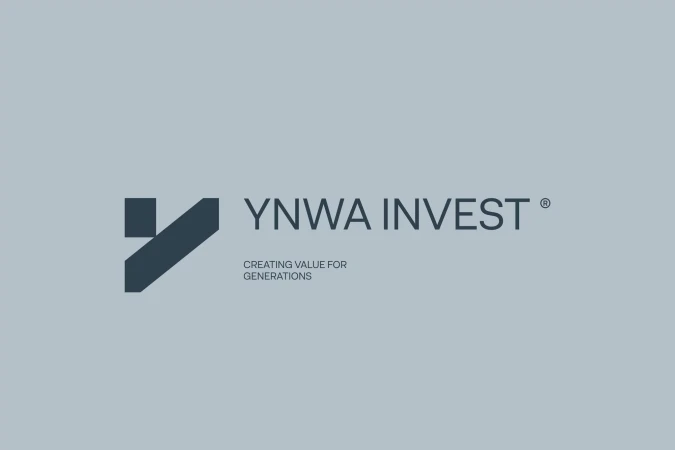 Dark grey YNWA Invest brand logo with tagline on a solid light grey background