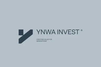 Dark grey YNWA Invest brand logo with tagline on a solid light grey background