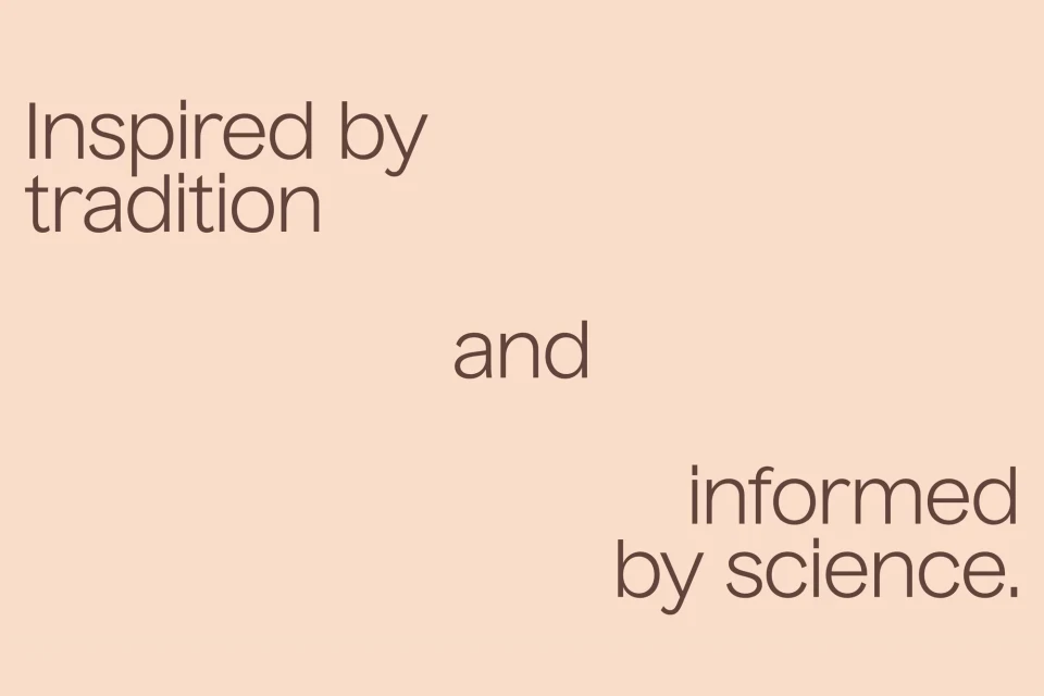 Text on a peach background reads, 'Inspired by tradition and informed by science.' A minimalist and clean graphic design.