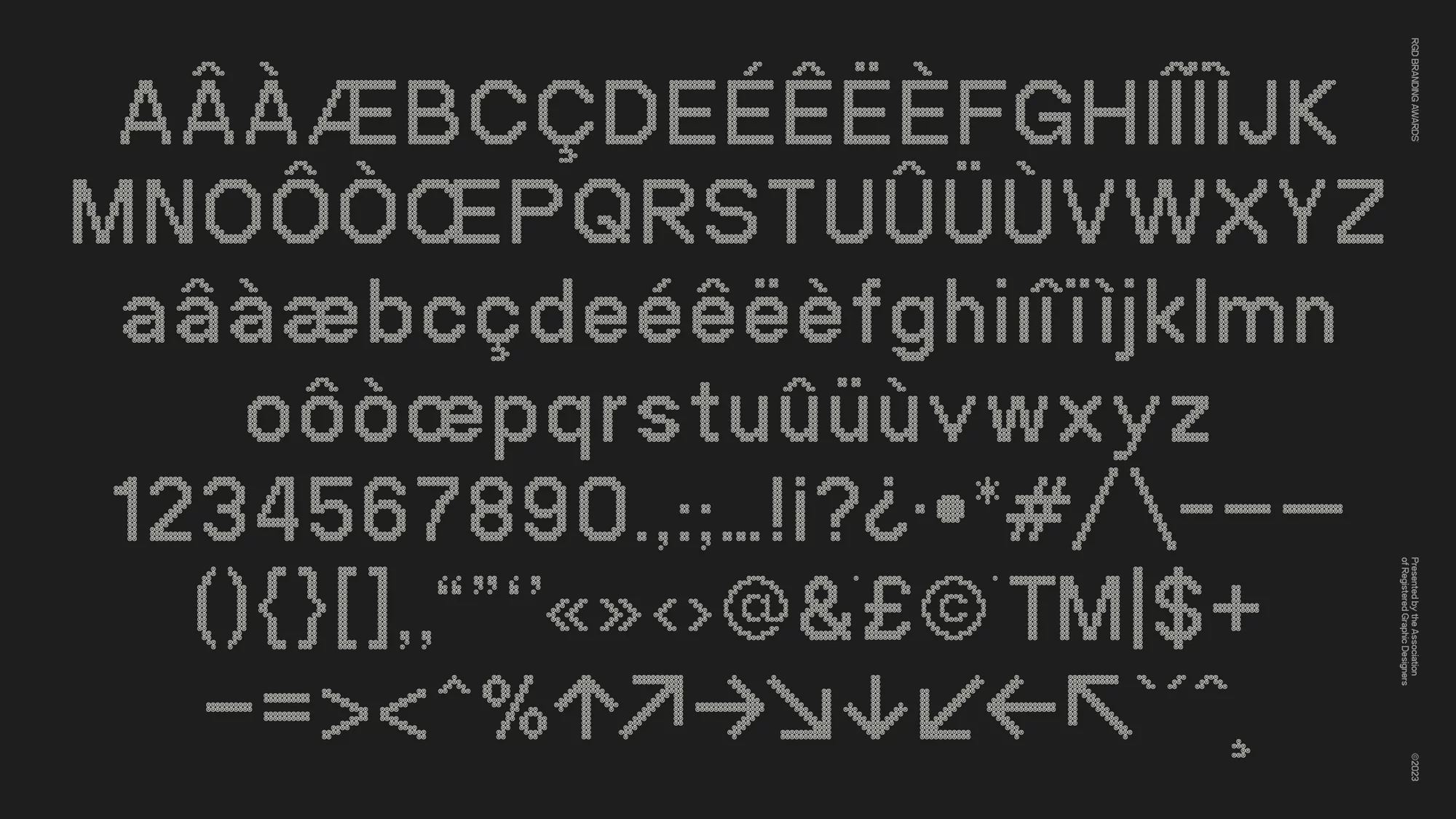 Knitted alphabet and characters in shades of grey, providing a unique, textured take on classic typography against dark grey backdrop.