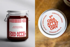Glass jar of Oma Appel strawberry jam with branded label alongside a top-down view of the jar lid.
