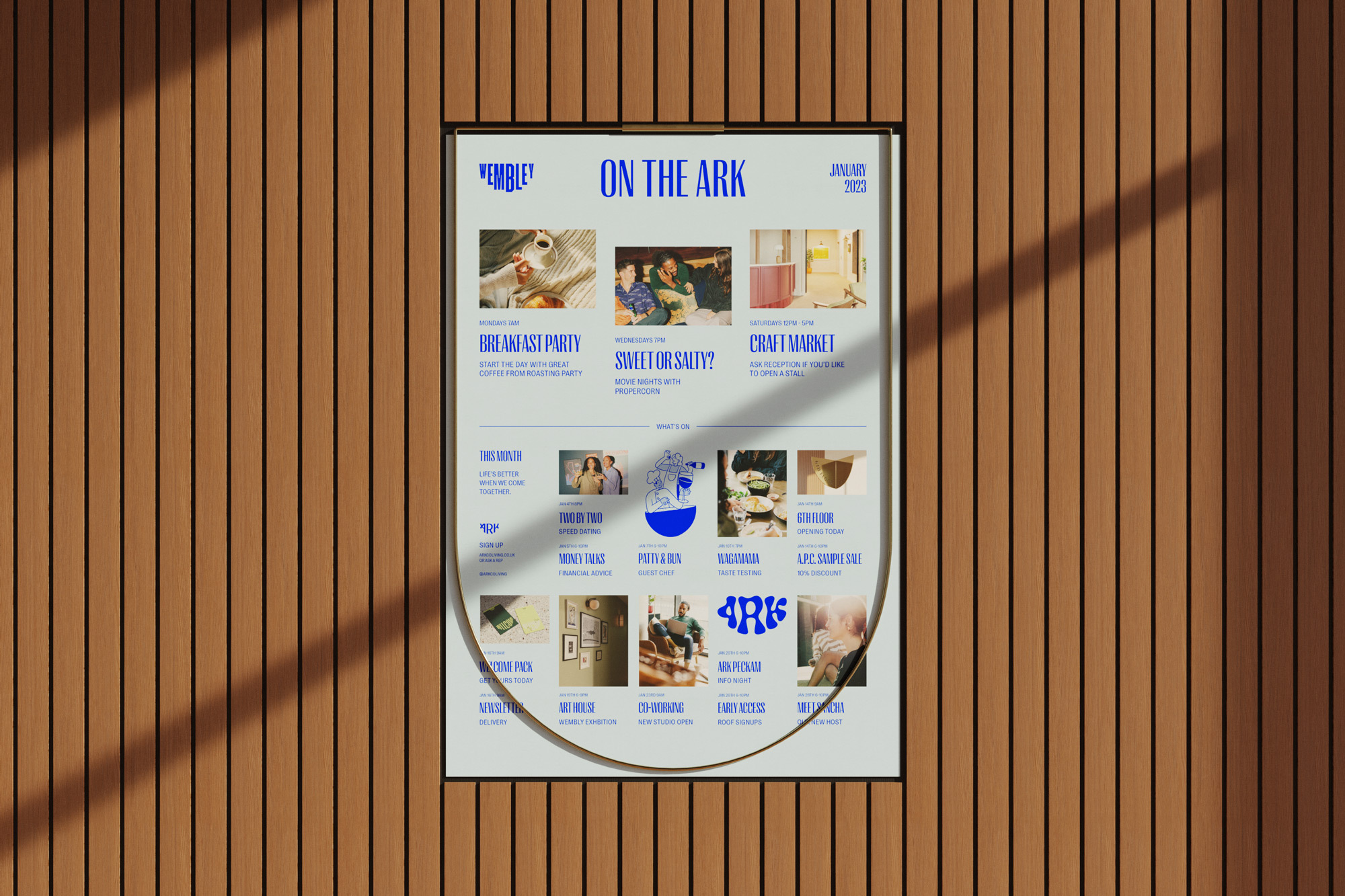 Event poster on wood wall. "On The Ark" event showcases a breakfast party, craft market, and other activities in January 2023.