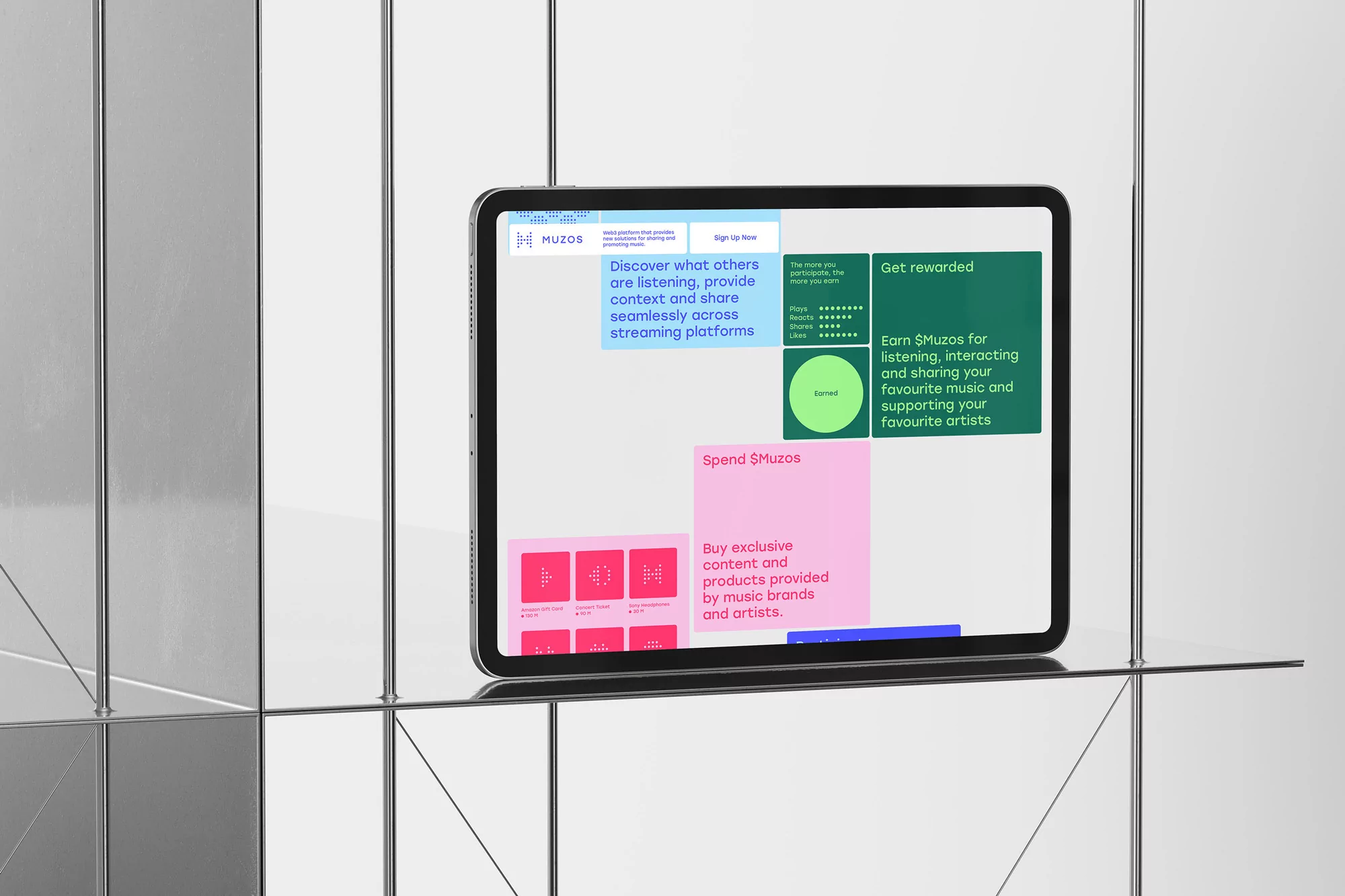 Digital tablet displays Muzos app promoting music discovery, rewards, and exclusive content against a modern reflective tiled background.