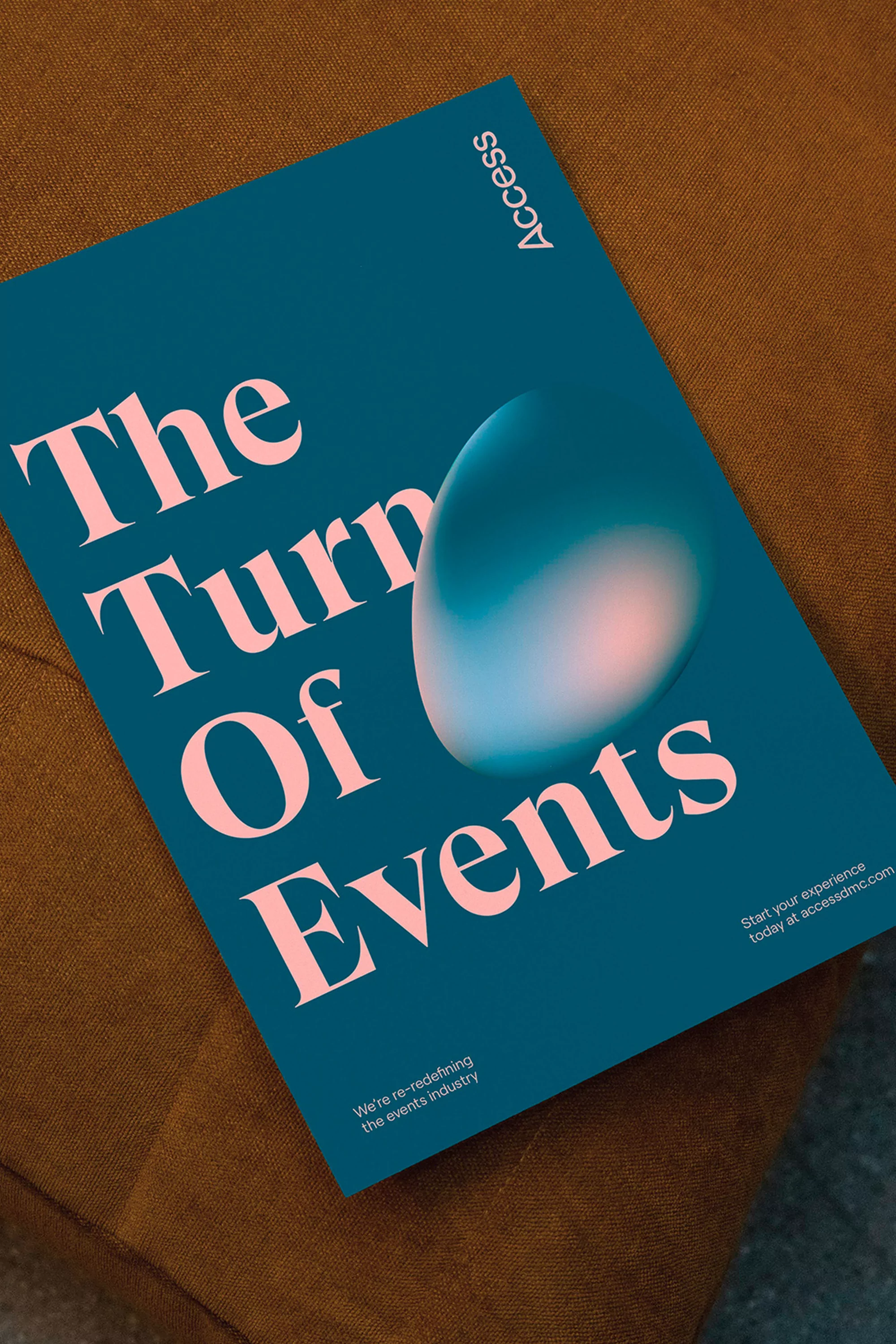 Promotional poster on brown fabric, with an abstract design and the text 'The Turn Of Events'.